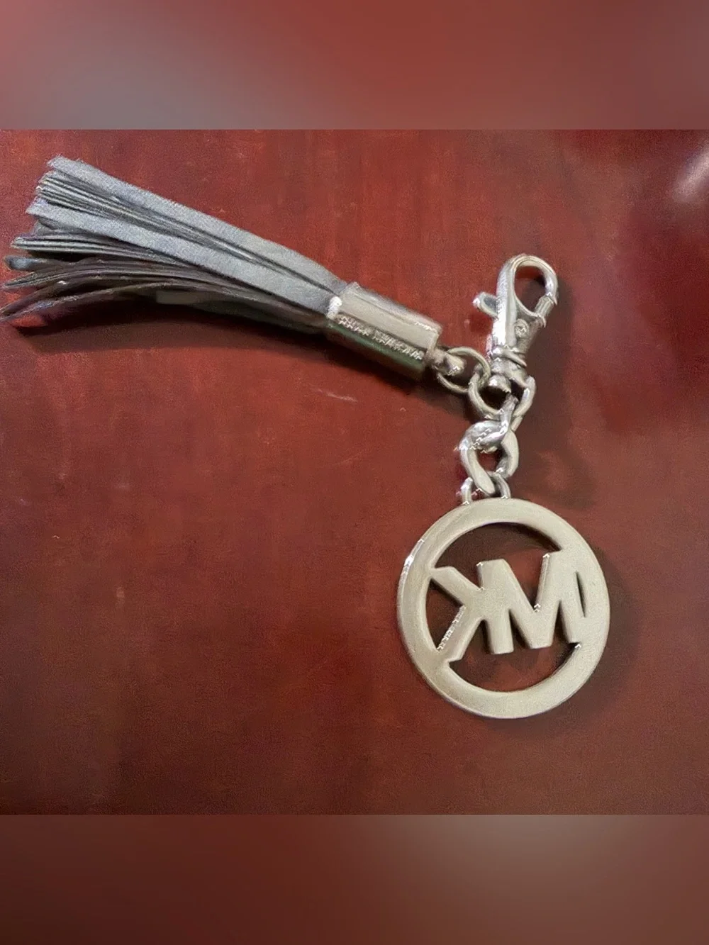 Michael Kors Silver Logo Tassel Key Charm